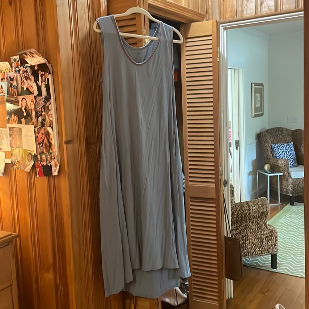 Pale blue Natural Life maxi dress with red stitching and slits on the sides.